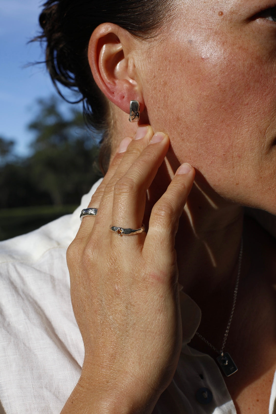 Silver half hoops with blue sapphire
